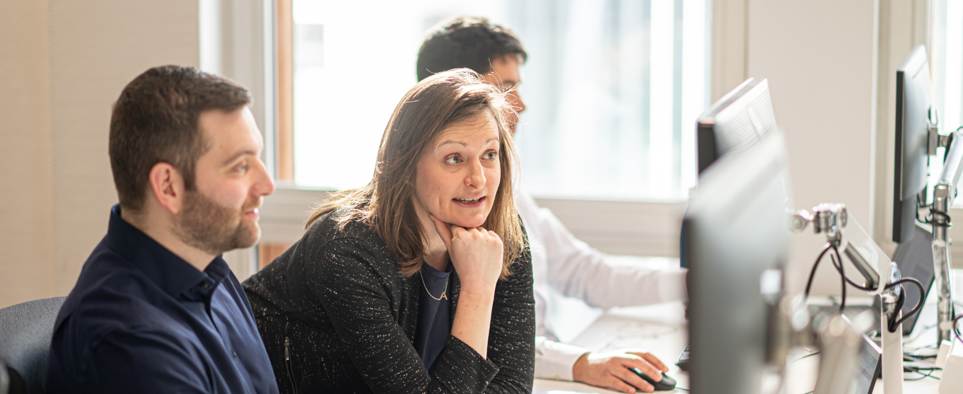 People looking at a computer screen